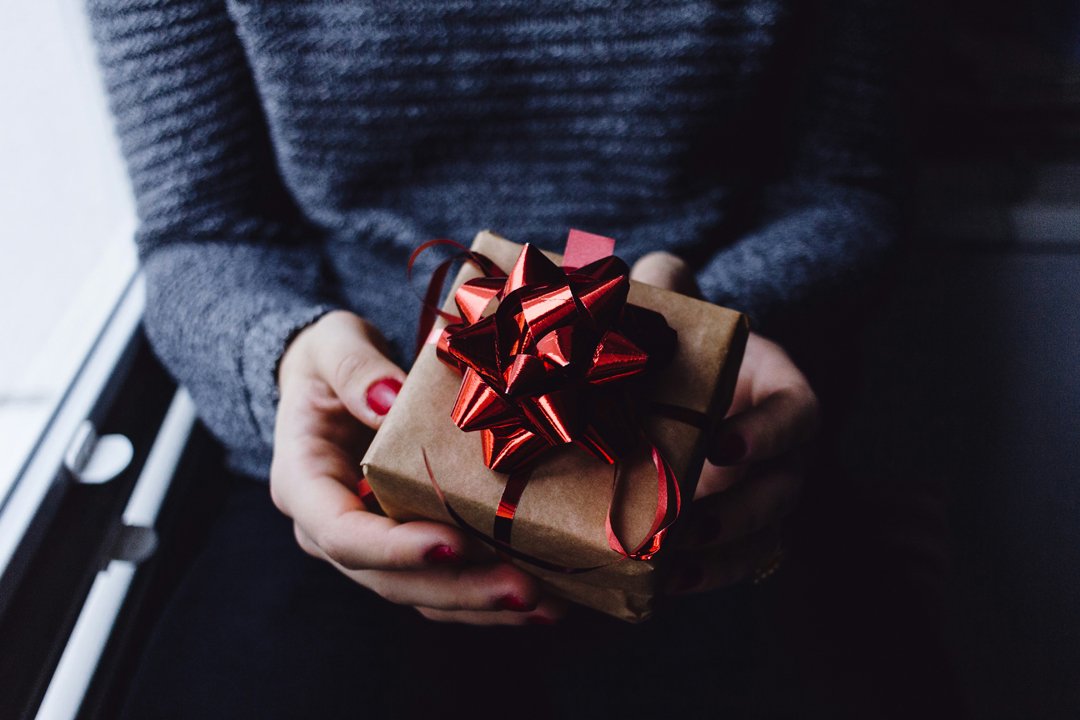 woman-holding-a-gift-unsplash