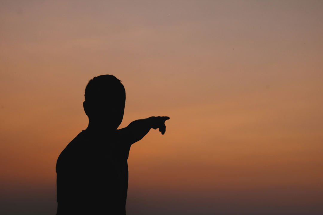 man-pointing-at-something-by-jacob-sedlacek-at-unsplash