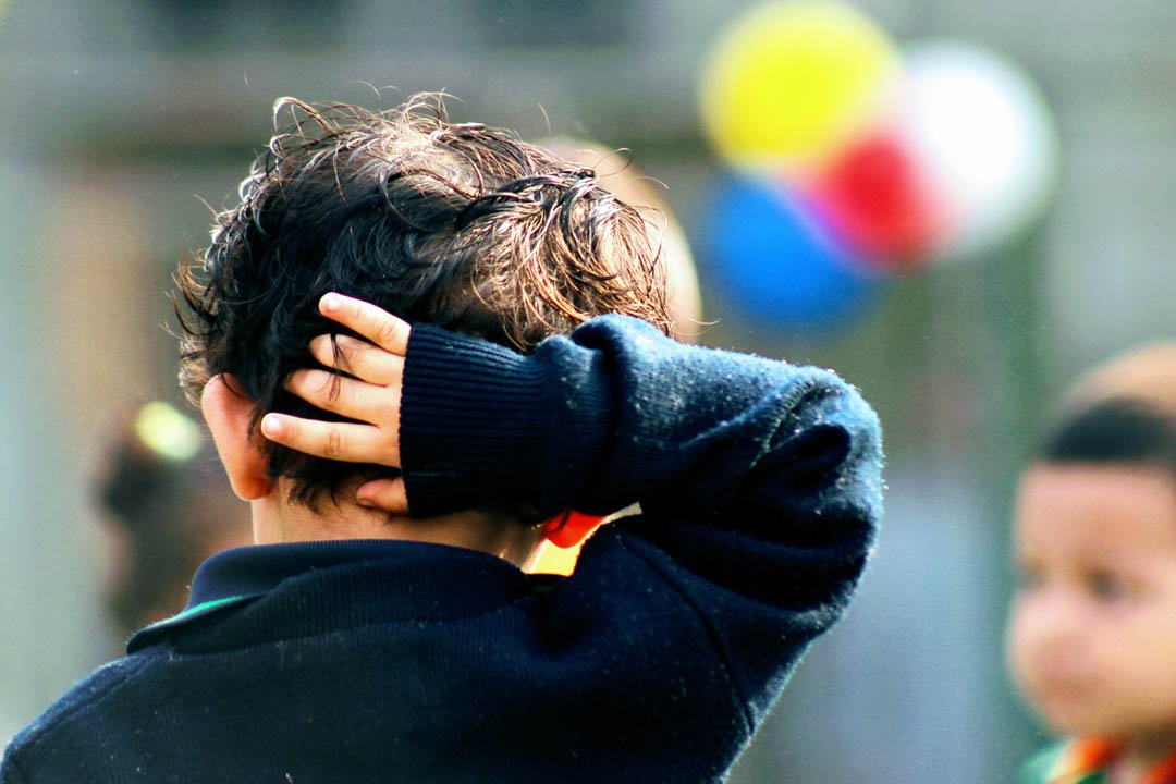 child-holding-his-head-after-school-md-mahd-unsplash